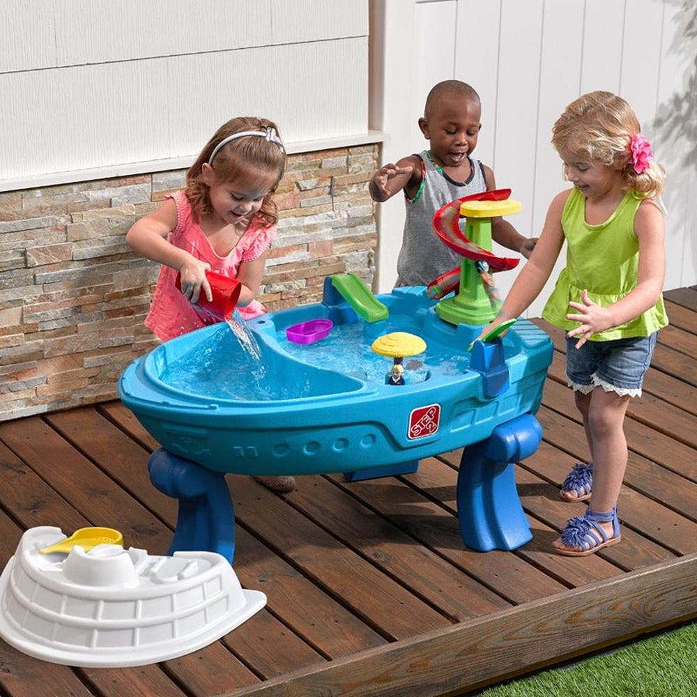 STEP2 Fiesta Cruise Water Table with Umbrella | Sand & Water Playset with Slide, Rain Shower & Lid (2-6 Years)