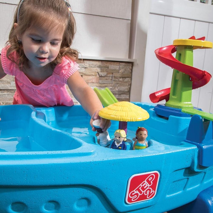 STEP2 Fiesta Cruise Water Table with Umbrella | Sand & Water Playset with Slide, Rain Shower & Lid (2-6 Years)