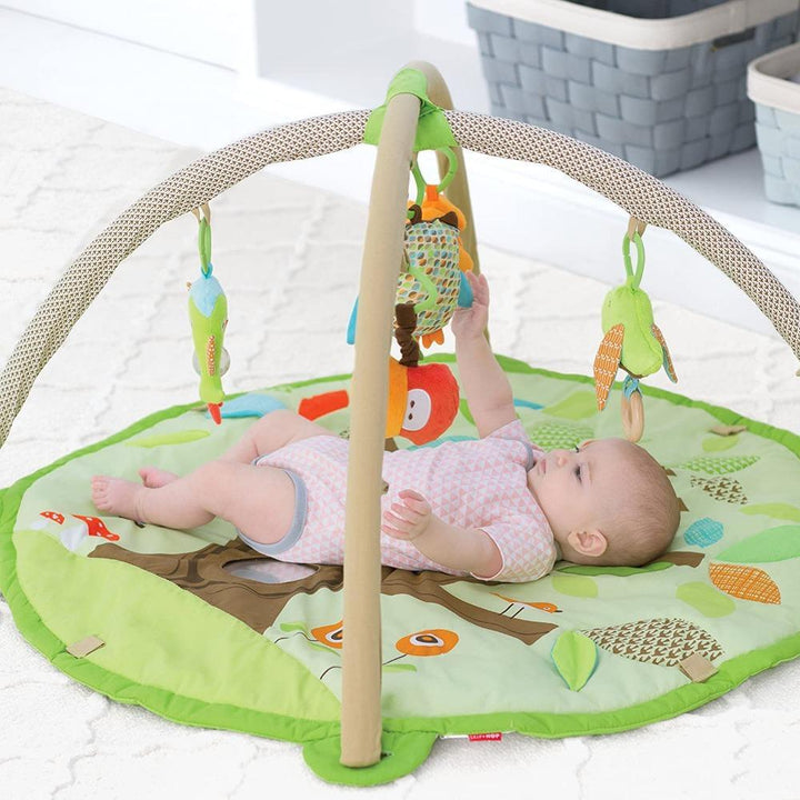 Skip Hop Treetop Friends Baby Activity Gym - Tummy Time, Overhead Play, Playmat | 17 Developmental Activities