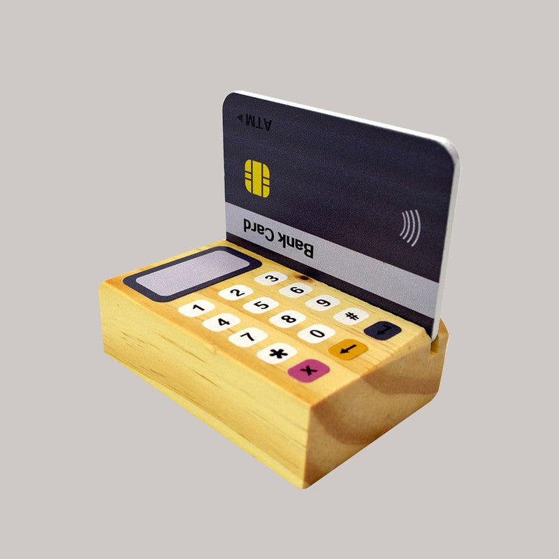 Funny Money - Cashier - Wooden Toy 1 Cashier, 8 Coins, 5 Currency Notes, 1 Credit Card, 1 Card Machine, 1 Display.