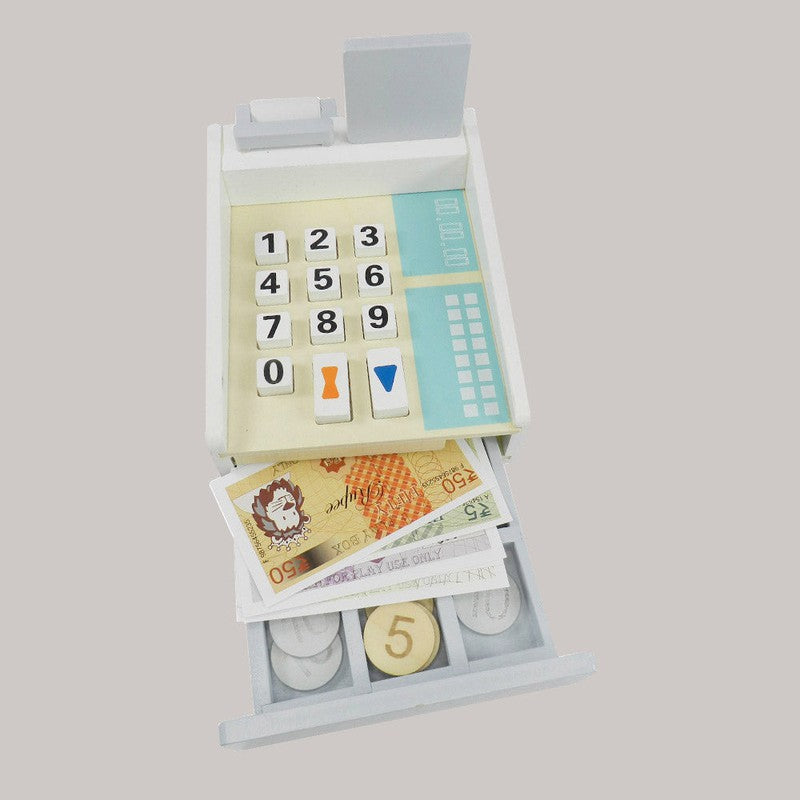 Funny Money - Cashier - Wooden Toy 1 Cashier, 8 Coins, 5 Currency Notes, 1 Credit Card, 1 Card Machine, 1 Display.