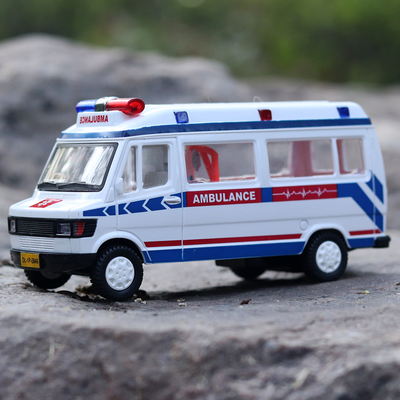 The white coloured ambulance toy with lights on top that makes it resemble real ambulance.