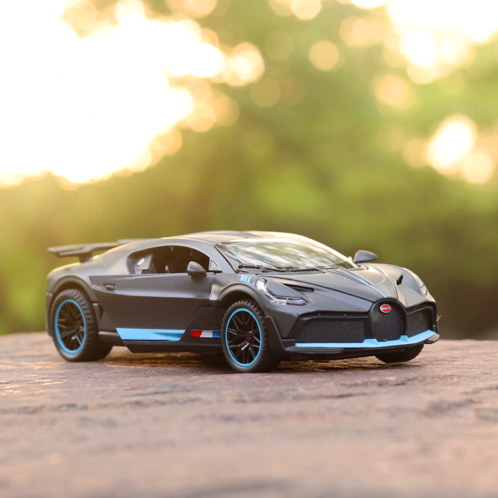 Supercar Diecast Scale Model (3214) resembling Bugatti Divo (comes with light & sound) - Assorted Colors (Scale 1:32)