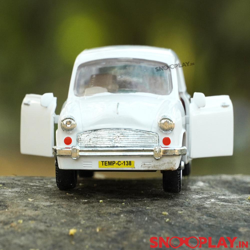 The made in India miniature model of Ambassador Car, with openable doors and rolling wheels.