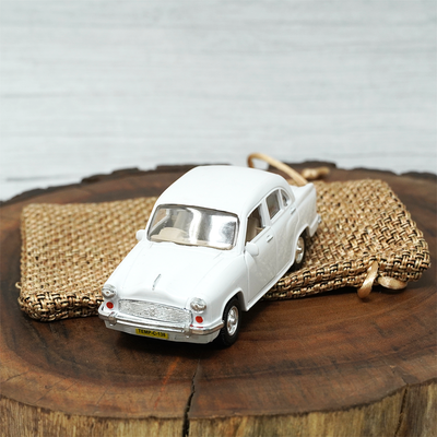 Ambassaor pull back toy car in sleek white exterior, that comes with a complementary jute pouch.