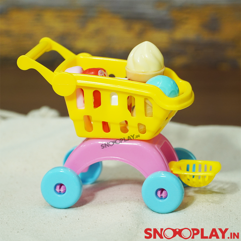 Shopping cart kit playset that is filled with ice cream cones and popsicles.