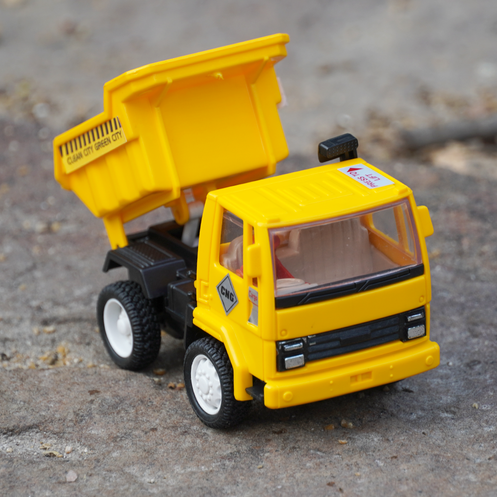 The dumper truck toy will pull back feature and a tilt able tray that tilts when the lever is pulled.