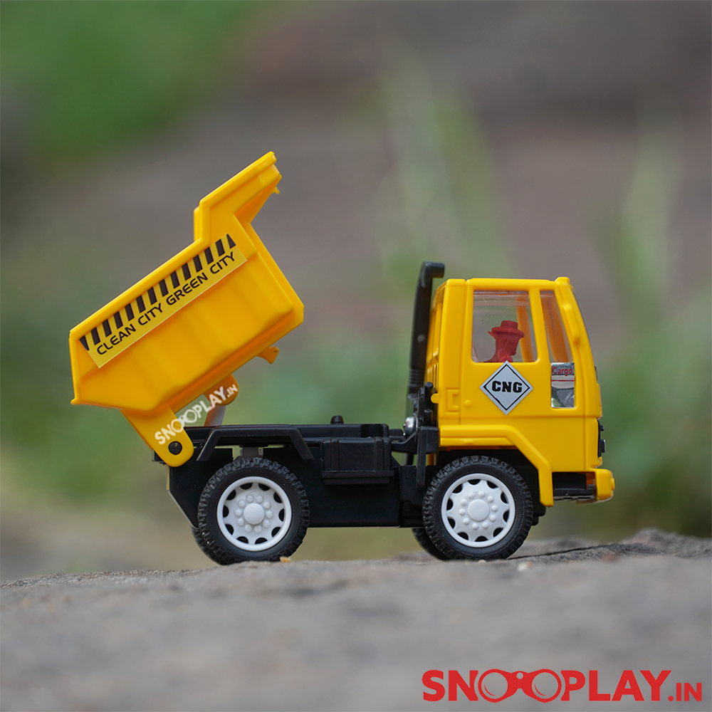 The dumper truck toy with intricate detailing, yellow in colour and has a human fitted inside.