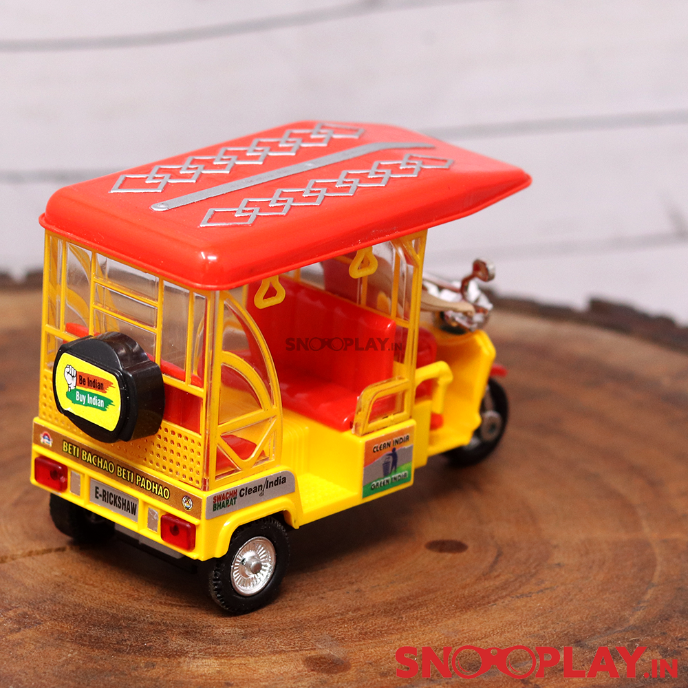 The E Rickshaw miniature model that has four roof handles, two small headlights in the back and a beautifully designed roof.
