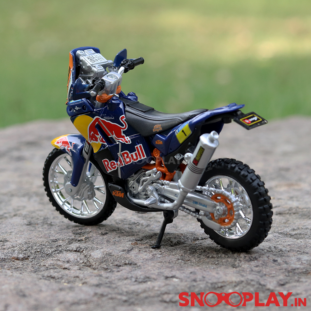 The back side of the KTM 450 rally dirt bike scale model with great detailing and with a working kickstand as well.