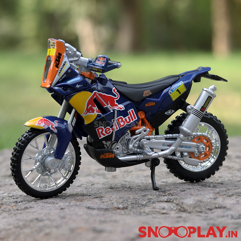 The greatly detailed and official licensed replica of the popular diecast bike KTM 450 Rally dirt bike diecast model in the scale 1:18.