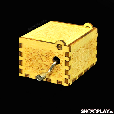 The beautifully carved wooden musical box with a hand crank on its side to play the tune Bella Ciao song.