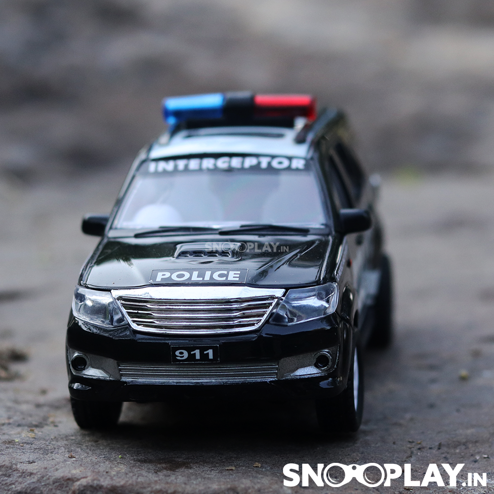 The front view of the police car toy, black and white in colour with police lights.