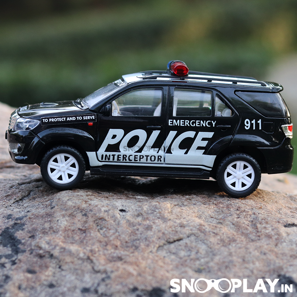 The police car toy that is covered with words like emergency, police, interceptor that gives it a realistic look.