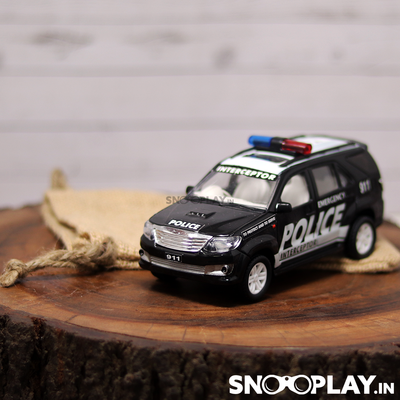 Police car toy that comes with a pull back feature and a complimentary jute pouch.