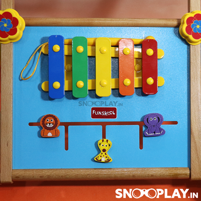 The 2 in 1 activity walker for kids that is multipurpose and made of wood and has a xylophone attached. 