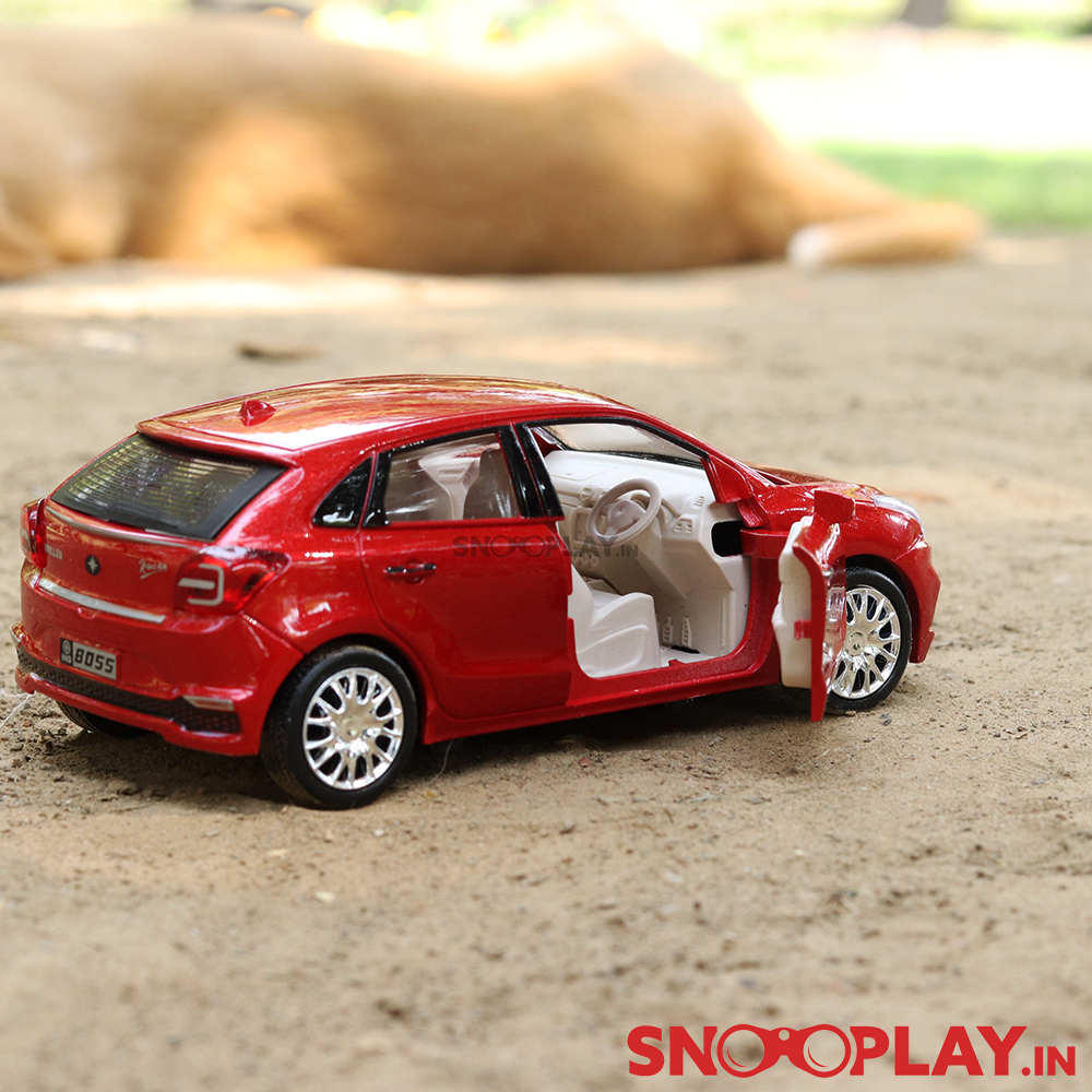 The red coloured Brilleo Toy Car of length 5.6 inches, resembling the Baleno Car, with classy interior.