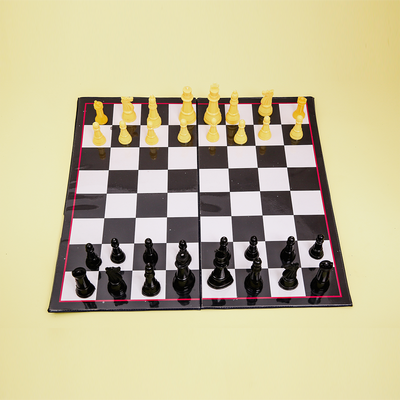 Chess board game with cream and black chess pieces, that improves strategic thinking abilities.