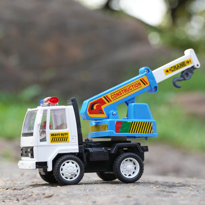 Right side of the crane toy truck with blue and white detailing and a pull back feature.