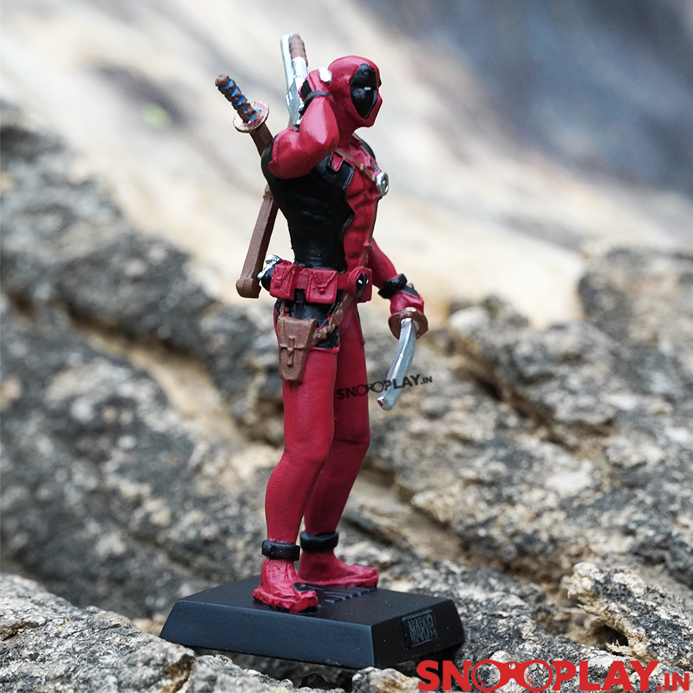 The amazing marvel superhero action figure, Deadpool, with red and black detailing on the body.