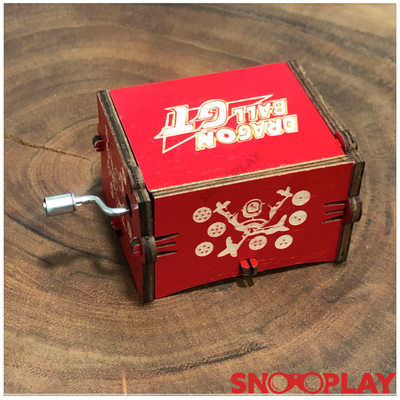 The non battery operated red coloured wooden musical box that plays the dragon ball z tone.