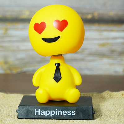Emoji bobblehead with smiling face and heart eyes is a perfect quirky gift.