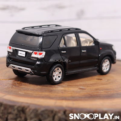 Black coloured Fortuner miniature toy car with pul back feature of length 6.12 inches.