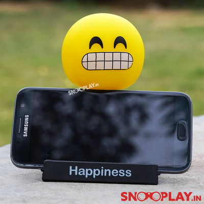 The grinning face emoji bobblehead with a phone stand, perfect for decor purposes.