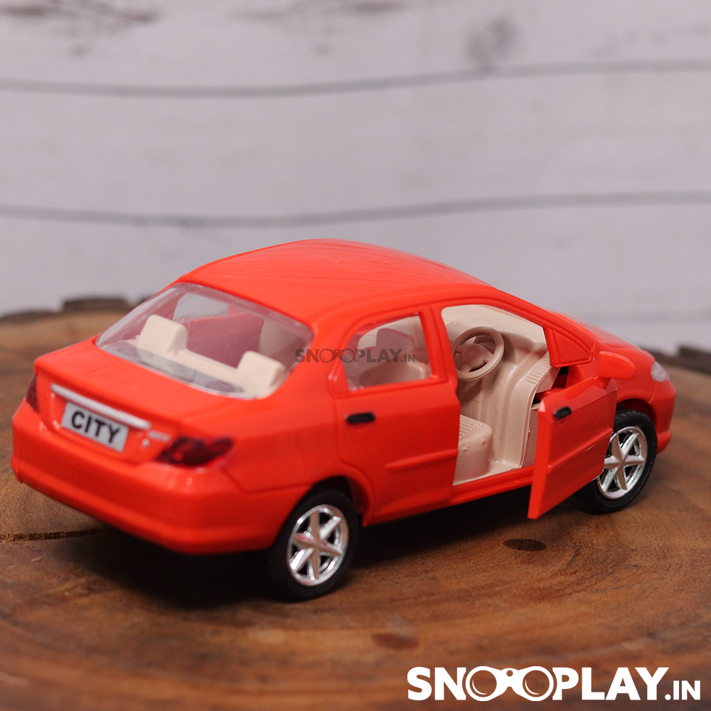 The non battery operated clssic red coloured honda city toy car with classy interior and a pull back feature.