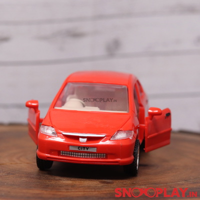 Perfect room /office decor option. the Honda city toy car, classic red in colour with opening doors.
