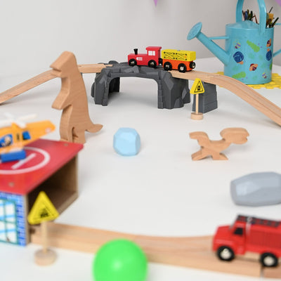 The Dino Land-Second Set-1 Plastic Bridge,2 Plastic Attachment,2 Dinosaurs,2 Stones,1 Helicopter,1 Helicopter Pad,1 Fire Extinguisher,2 Signals,15 Tracks.