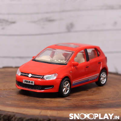 A miniature car toy of Polo Car with pull back feature, red in colour.