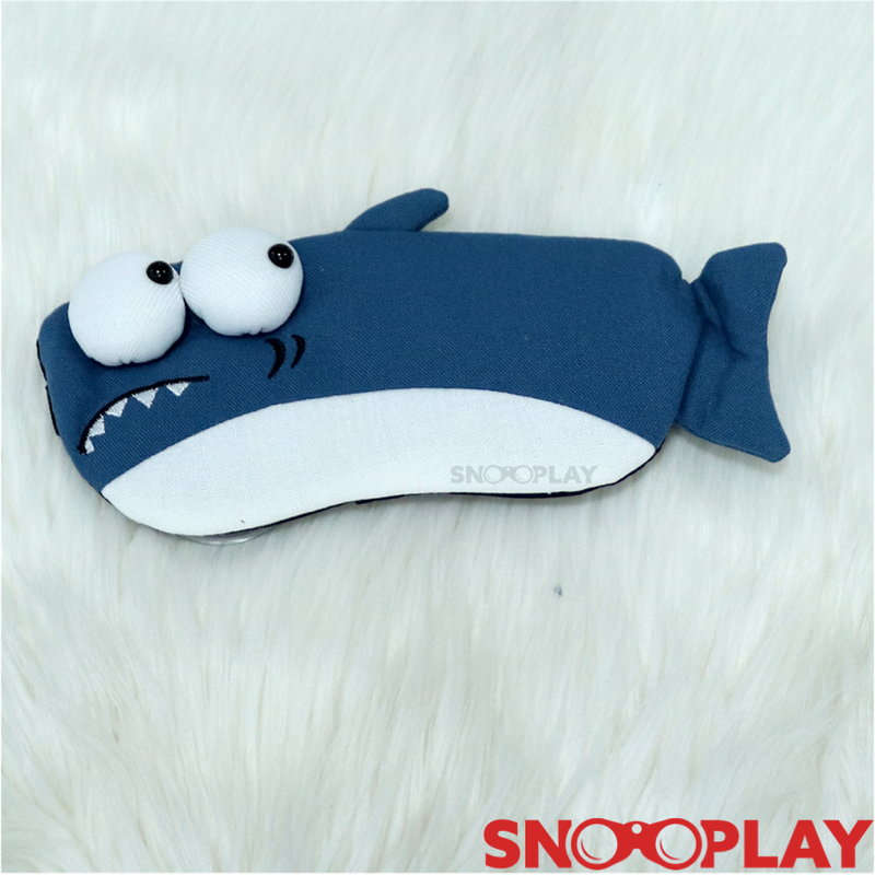 A perfect travel essential, blue coloured 3D shark eye mask with a gel pad, with bulging eyes 