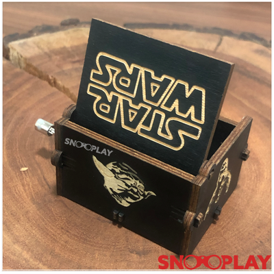Beautifully carved surface of the wooden musical box that plays Star Wars theme song.