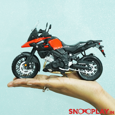 Suzuki V-Storm toy bike, that serves as a great collectible for all the motorbike lovers, with a nosel like front, rear suspension, rolling wheels and movable steering wheels.